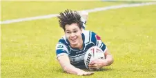  ?? Picture: Nev Madsen ?? HAIR RAISING: Angus Wright scored two tries for St Mary’s College.