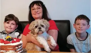  ??  ?? Reunited: Anne Bell and Oscar with grandsons Daniel (left) and Thomas