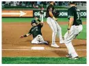  ?? MATTHEW BLACK / CONTRIBUTE­D ?? Dayton’s Austin Hendrick is safe at third on Justice Thompson’s RBI grounder in the fourth inning.