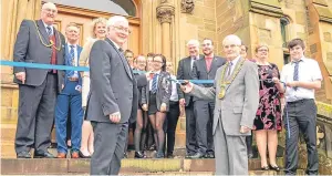  ??  ?? The ribbon cutting at Morgan Academy’s 150th anniversar­y lunch. Chairman of the FPs Associatio­n Rodger Brunton holds the tape for Lord Provost Ian Borthwick to do the honours. From left, David Adam, Dean of Guild; Robert Dunn, Deacon Convenor of the...