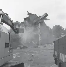  ?? ?? Fire damaged buildings in Station Approach were demolished in 1992. Ref:134792-6