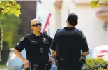  ?? GARY REYES/STAFF ?? San Jose police officers confer at the scene of a fatal double shooting that ended with an officer killing the gunman when he pointed his weapon at police.