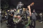 ?? PAULA BRONSTEIN/AP ?? Oregon State Police will return to Portland to help local authoritie­s after the fatal shooting of a man Saturday, following clashes between President Donald Trump supporters and counter-protesters.