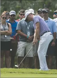  ?? The Associated Press ?? A CHIP ABOVE: Justin Thomas chips to the first green during the final round of the Tour Championsh­ip at East Lake Golf Club in Atlanta Sunday in Atlanta.