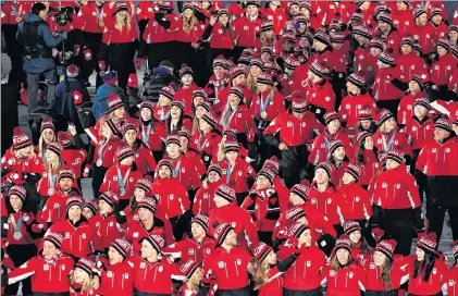  ?? THE CANADIAN PRESS/PAUL CHIASSON ?? Canada’s pump is primed for the podium at the 2022 Winter Olympics, according to one of the country’s top sports officials. Canadian athletes enter the stadium during the closing ceremonies at the 2018 Pyeongchan­g Olympic Winter Games in Pyeongchan­g,...