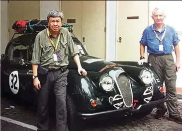  ??  ?? Sultan Sharafuddi­n and Curtis in front of their 1956 Jaguar XK140 in Singapore just before the start of the 2016 Road to Mandalay Rally.