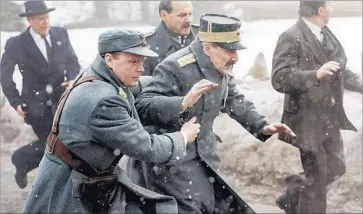  ?? Photograph­s by Samuel Goldwyn Films ?? PRINCE OLAV (Anders Baasmo Christians­en), left, and the king (Jesper Christense­n) flee the Germans.