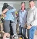  ?? The Associated Press ?? Justin Herbert, left, gets a hug at his family’s home after he’s announced as the sixth pick overall Thursday by the Los Angeles Chargers.