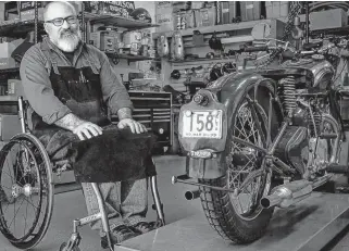  ??  ?? Greg Williams with a 1939 Triumph Speed Twin on the lift.