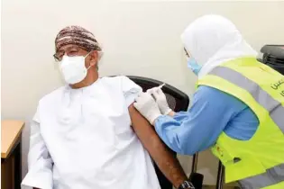  ??  ?? Dr Ahmed bin Mohammed Al Saidi, Minister of Health, became the first person in the Sultanate to receive the COVID-19 vaccine.