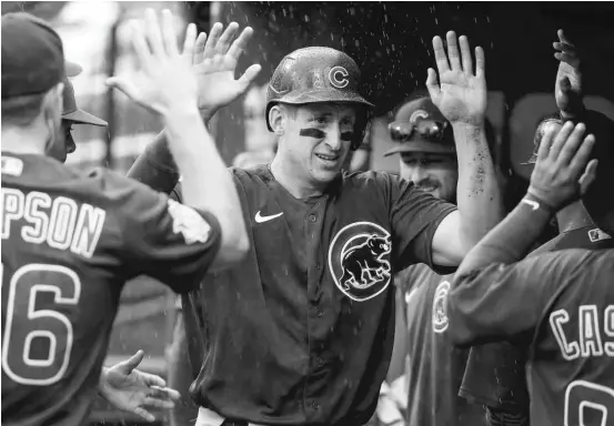  ?? SCOTT KANE/GETTY IMAGES ?? First baseman Frank Schwindel went 2-for-3 with two doubles, two runs scored and an RBI in the Cubs’ season finale Sunday.