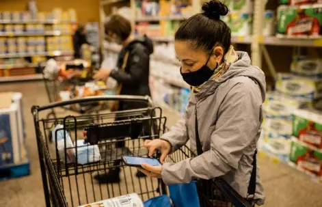  ?? Rosem Morton, © The New York Times Co. file ?? Jane Singer, an Instacart shopper, is shown in Harrisburg, Pa., in 2020. The grocery delivery startup changed its leadership, slashed its valuation and shifted its strategy after sales slowed.