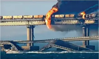  ?? ?? The tanker train burning on the damaged Crimean Bridge on October 8.