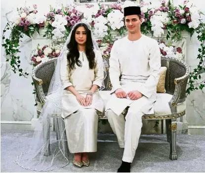  ?? — Bernama ?? Royal newlyweds: Tunku Aminah and Dennis Muhammad’s solemnisat­ion ceremony at Istana Bukit Serene was witnessed by close family members and friends.