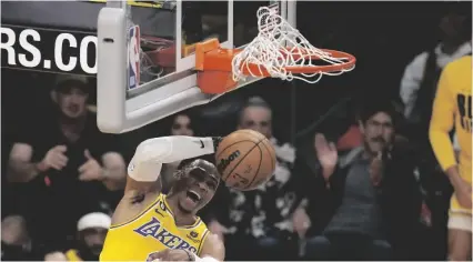  ?? AP PHOTO/MARCIO JOSE SANCHEZ ?? Los Angeles Lakers guard Russell Westbrook dunks during the first half of an NBA basketball game against the Oklahoma City Thunder on Feb. 7 in Los Angeles.