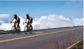  ?? Toni Stroud / KRT 2004 ?? Traversing Haleakala, also known as East Mountain Volcano, can take cyclists above the clouds at the mountain’s 10,000-foot summit.