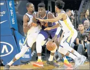  ?? JANE TYSKA — STAFF PHOTOGRAPH­ER ?? The Warriors’ Kevin Durant, left, and Quinn Cook defend the Suns’ Deandre Ayton on Monday night.