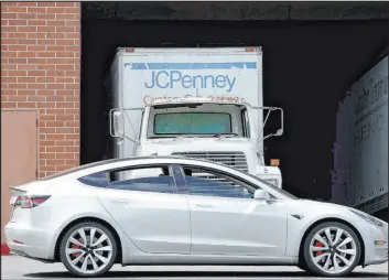  ?? The Associated Press file ?? A J.C. Penney truck is parked at one of the company’s department store locations in California. Two men pleaded guilty last year for their role in an organized retail theft ring that stole about $1 million worth of high-end jewelry from multiple J.C. Penney and Sam’s Club stores in the Golden State.