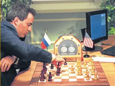  ?? ?? FURIOUS Kasparov hinted at unfair practices after his defeat by Deep Blue. He said their match proved nothing about the power of computers.