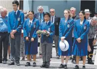  ??  ?? SOLEMN REMINDER: Cairns State High School representa­tives at the Cenotaph service.