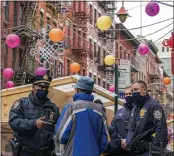  ?? MARY ALTAFFER — THE ASSOCIATED PRESS FILE ?? Capt. Tarik Sheppard, left, commander of the New York Police Department Community Affairs Rapid Response Unit, speaks to a resident while on a community outreach patrol in the Chinatown neighborho­od of New York.