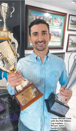  ?? ?? Trainer Michael Costa with the Pink Ribbon Cup trophies. Picture: Adam Gardini