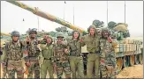  ?? AFP FILE ?? Russian and Indian soldiers gesture after the INDRA IndoRussia joint military drill at the Mahajan field firing range in Rajasthan on October 25, 2013.