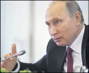  ?? ALEXEI DRUZHININ / SPUTNIK, ?? Russian President Vladimir Putin speaks to internatio­nal news agencies in St. Petersburg on Thursday.