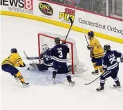  ?? Steve Musco/Contribute­d photo ?? Quinnipiac’s Sam Lipkin, No. 28, scores his second goal of the game just 37 seconds after his first goal, to give the Bobcats a 3-2 lead over Yale on Feb. 17.