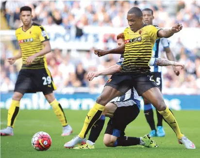  ??  ?? Odion Ighalo of Watford fights for the ball with Jack Colback of Newcastle during their match in the Barclays English Premier League.