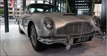  ?? Jacquelyn Martin / Associated Press ?? A car used in a James Bond movie adorns the lobby of the new Internatio­nal Spy Museum last week in Washington. Take a back seat James Bond, because it’s the stories of real-life spies that take center stage at the new museum in Washington. The expanded museum in its new building will open Sunday.