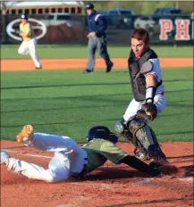  ?? LARRY GREESON / For the Calhoun Times ?? Calhoun’s Bryson Trammell (left) slides in for a run past the tag of Sonoravill­e catcher Storm Carnes during the third inning.