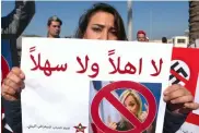  ?? — AFP ?? A Lebanese woman protests against France’s presidenti­al candidate Marine Le Pen in Beirut on Tuesday.