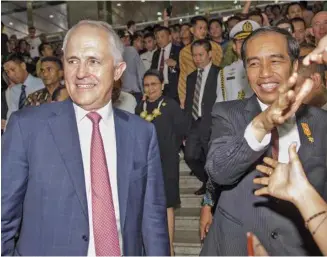  ??  ?? Prime Minister Malcolm Turnbull and President of Indonesia Joko Widodo make a visit to Tanah Abrang market in Jakarta, in 2015