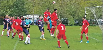  ??  ?? Saints had Shawlands under pressure for long periods in the game but this time Ross McDougall heads the ball clear. Match report and photos: Derek Black