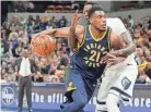  ?? SPURLOCK BRIAN ?? Indiana Pacers forward Thaddeus Young (21) drives to the basket against Memphis Grizzlies forward Jamychal Green (0) on Oct 17, 2018.