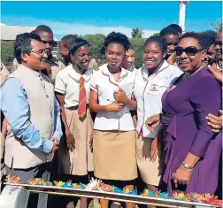  ??  ?? Readers’ Club members being a part of the garlanding of Mahatma Gandhi’s statue at the Jamaica Library Service Headquarte­rs with the Indian High Commission­er M. Sevala Naik (left) and Olivia Grange (right), minister of culture, gender, entertainm­ent...