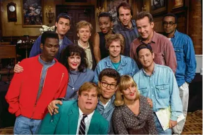  ?? JUSTIN SUTCLIFFE/AP ?? The “SNL” cast in 1992. Front (from left): Chris Farley, Al Franken, and Melanie Hutsell. Middle: Chris Rock, Julia Sweeney, Dana Carvey, and Rob Schneider. Back: Adam Sandler, David Spade, Ellen Cleghorne, Kevin Nealon, Phil Hartman, and Tim Meadows.