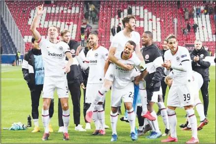  ??  ?? Eintracht Frankfurt players celebrate end of the Europa League Round of 32 second leg soccer match between FC Red Bull Salzburg and Eintracht
Frankfurt at the Red Bull Arena in Salzburg, Austria, Friday, Feb 28, 2020. (AP)