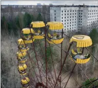  ??  ?? An abandoned fairground carousel in a park, seen in the ghost town of Pripyat close to the Chernobyl nuclear plant