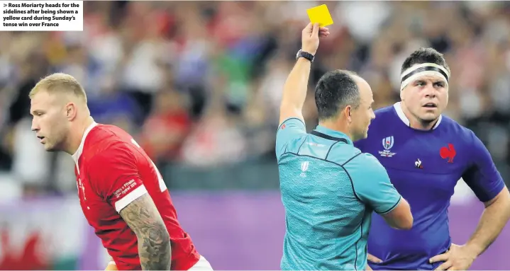  ??  ?? > Ross Moriarty heads for the sidelines after being shown a yellow card during Sunday’s tense win over France
