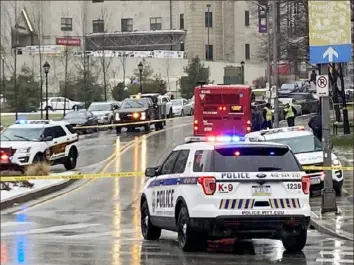  ?? KDKA-TV ?? In this screen grab from a video, police and other emergency vehicles respond to the scene of a fatal accident that killed a Pitt senior on Jan. 18 at the corner of De Soto Street and Fifth Avenue.