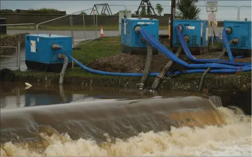  ??  ?? The pumping of water at Courtown Pier had to stop on Sunday because of heavy rain.