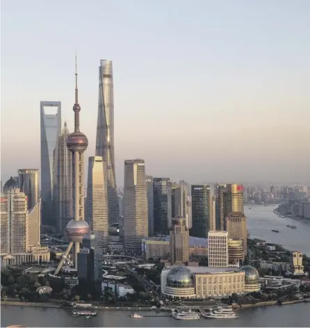  ??  ?? 0 The towering skyline of Pudong, the financial district of Shanghai, shows the rise of the East
PICTURE: AFP/GETTY