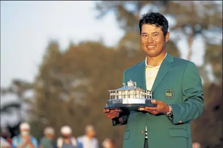  ?? JARED C. TILTON / Getty Images ?? Hideki Matsuyama poses with the Masters trophy after winning the Masters on Sunday at Augusta National Golf Club in Augusta, Ga.