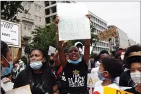  ?? JACQUELYN MARTIN — THE ASSOCIATED PRESS ?? Demonstrat­ors including Morgan Hubbard, 13, center, of Washington, protest Saturday near the White House over the death of George Floyd.