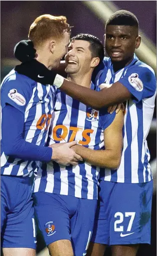  ??  ?? Kilmarnock congratula­te Jordan Jones (centre) after he scored the winner for the visitors at Fir Park