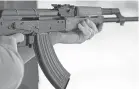  ?? TREVOR HUGHES/USA TODAY ?? Gun manufactur­ers have duplicated the design of the Soviet AK-47.