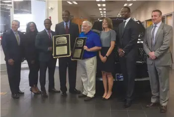  ??  ?? Sutton Ford and Lincoln management pose with the two President’s Awards. Pictured ( l to r) are Dave Mason, Simone Toney, Ivan Boykin, Nate Sutton, Randy Mohrbach, Dawn Valeski, John Allen and Randall Rightmyer.