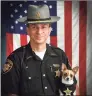  ?? John Hoffart / Associated Press ?? Then Sheriff Dan McClelland and his small police dog Midge in 2006.